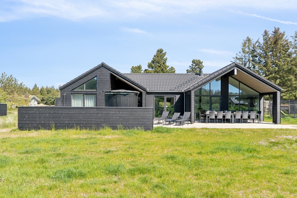 Dette lekre huset med svømmebasseng, nr. 540, med plass til 14 personer, ligger i Vestjylland