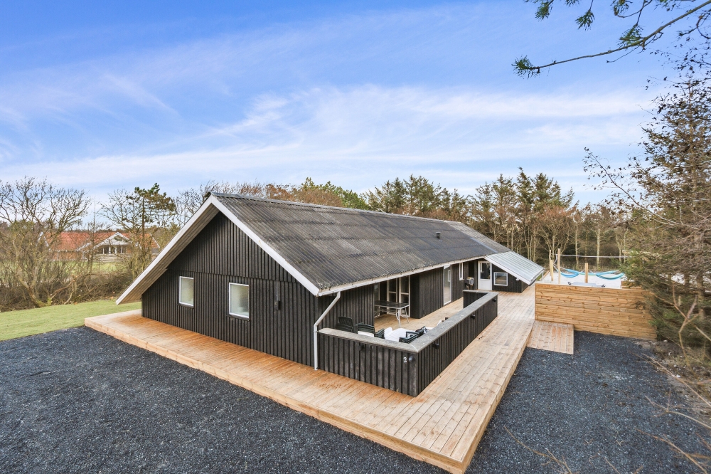 Dette lekre huset med svømmebasseng, nr. 623, med plass til 15 personer, ligger i Vestjylland